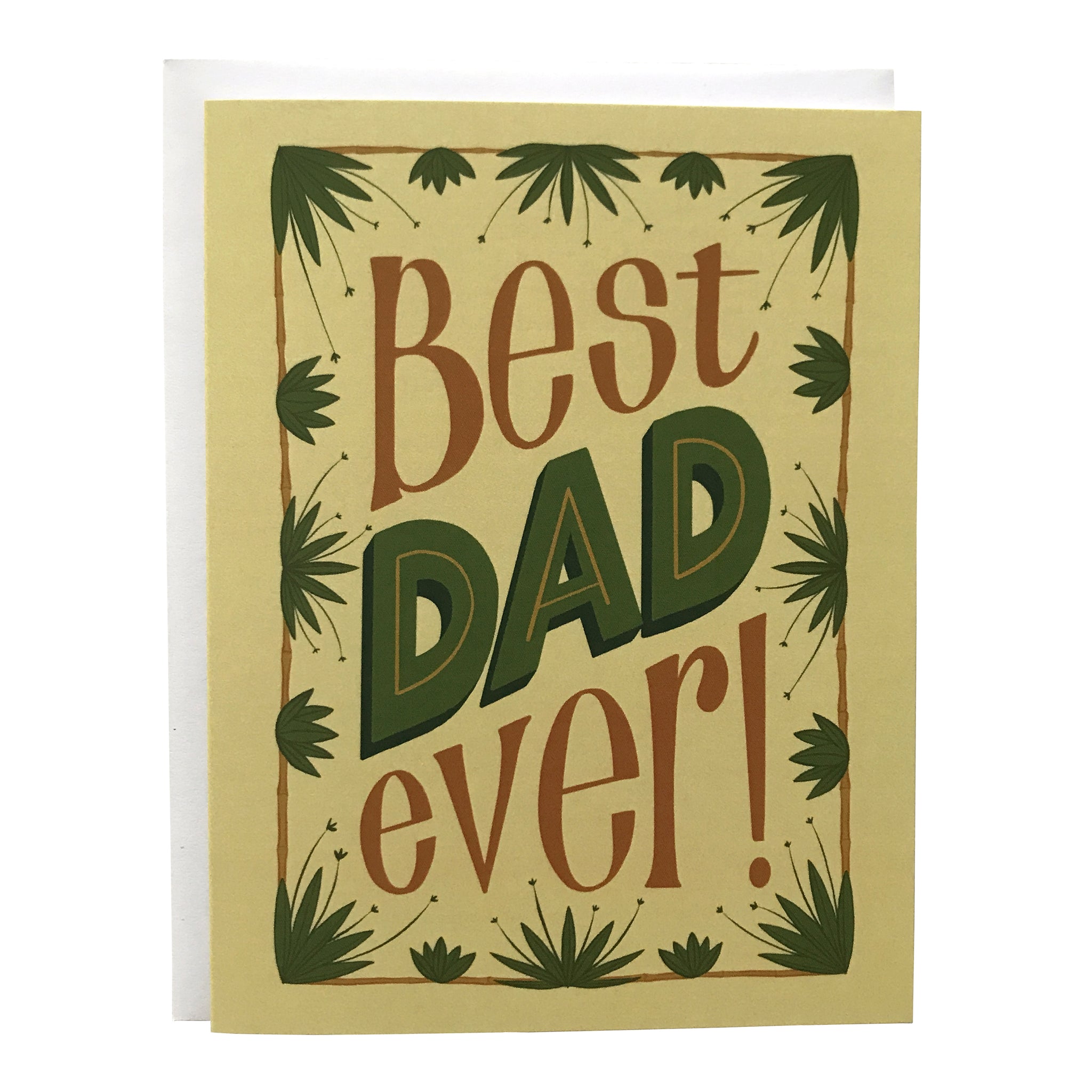 A pale yellow card reads "Best DAD ever!" in brown and green hand lettering. The letters are framed in a brown rectangle out of which sprout green tropical plants.The card sits against a white envelope on a white background.