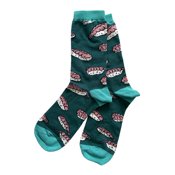A pair of green socks is patterned with shrimp nigiri style sushi which is shrimp on top of rice. The socks have turquoise cuffs, heels, and toes.